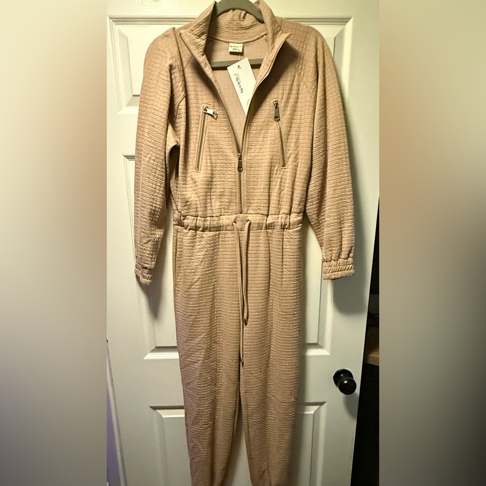 By O La La. Brand new jumpsuit with tags. Size S